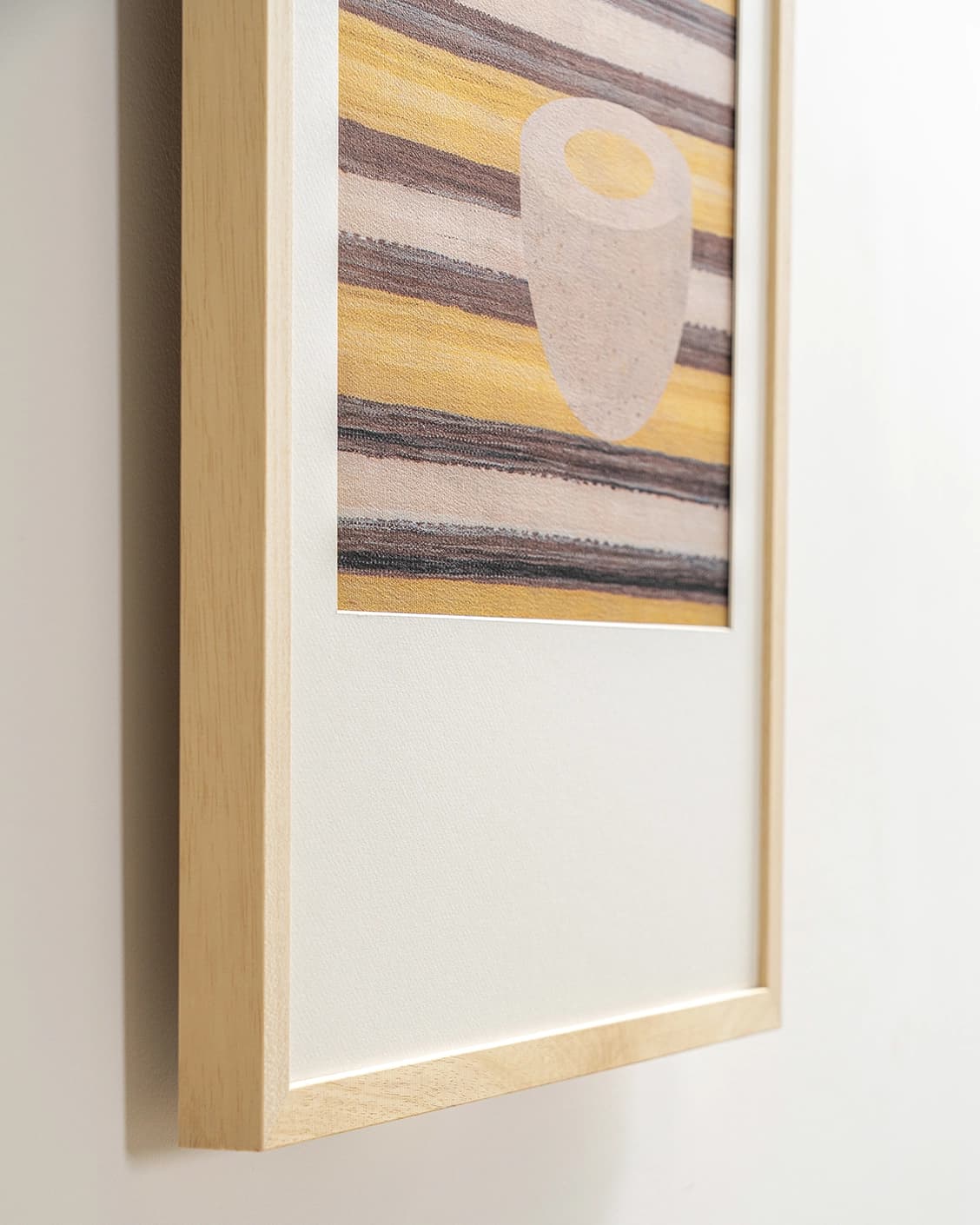 Eggsercise fine art print in yellow, brown and beige, shown in a lifestyle close-up view as image 5