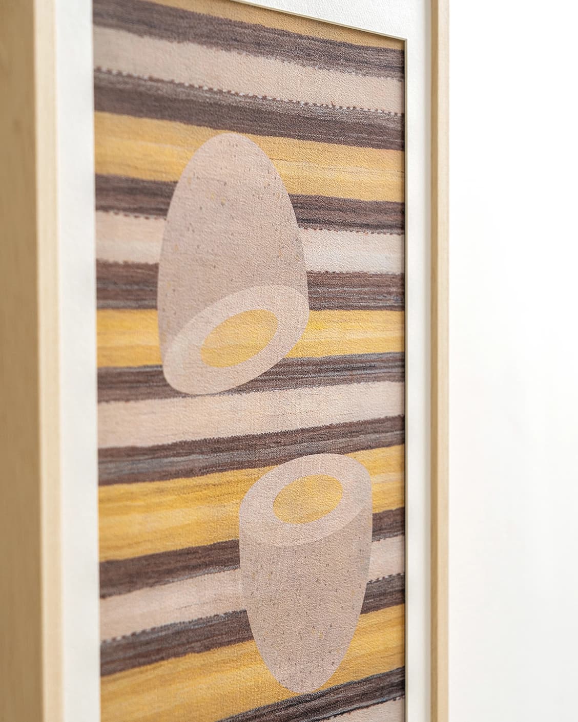 Eggsercise fine art print in yellow, brown and beige, shown in a lifestyle close-up view as image 6