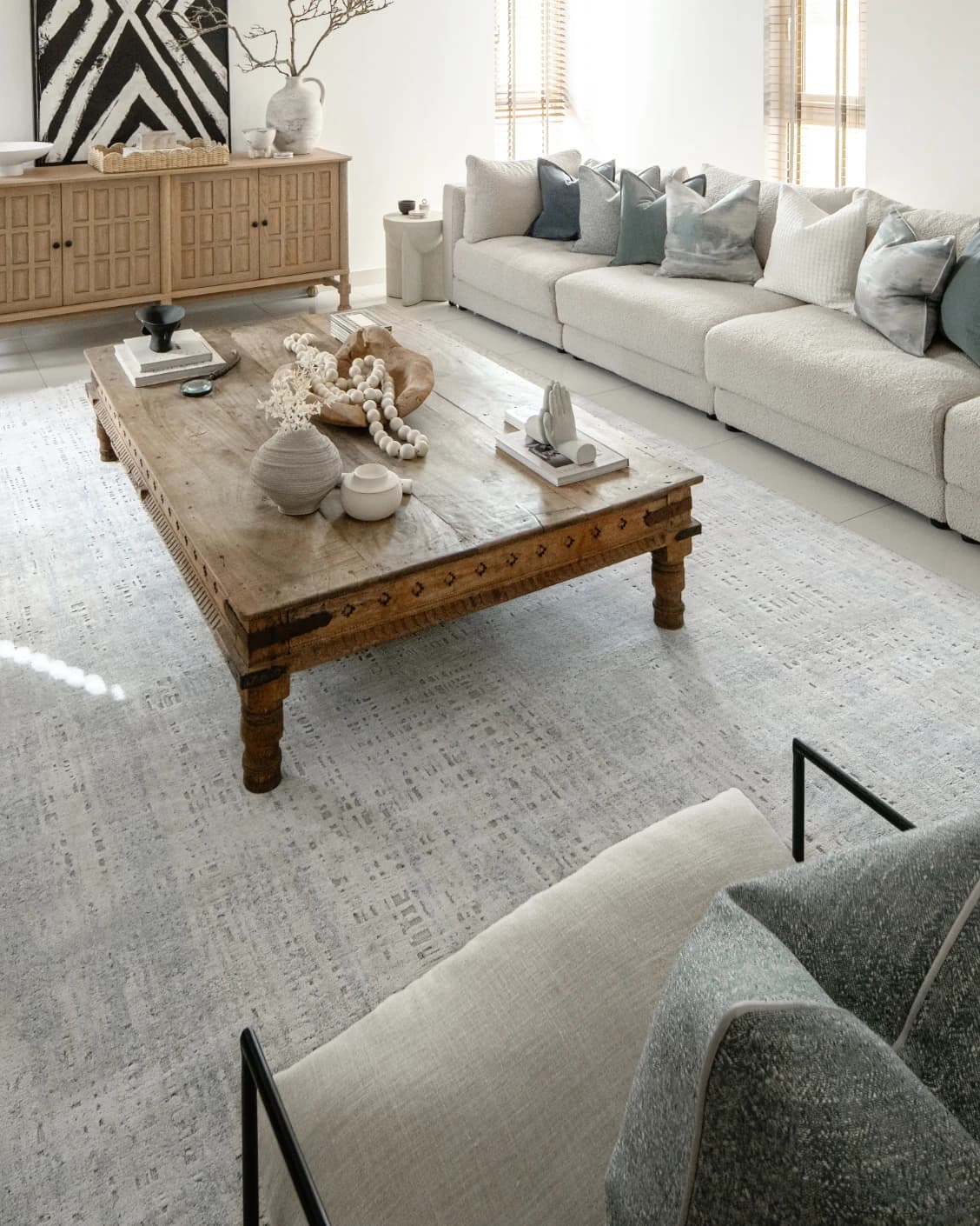 Eh Dillan Ocean carpet in blue, shown in a lifestyle left view as image 6
