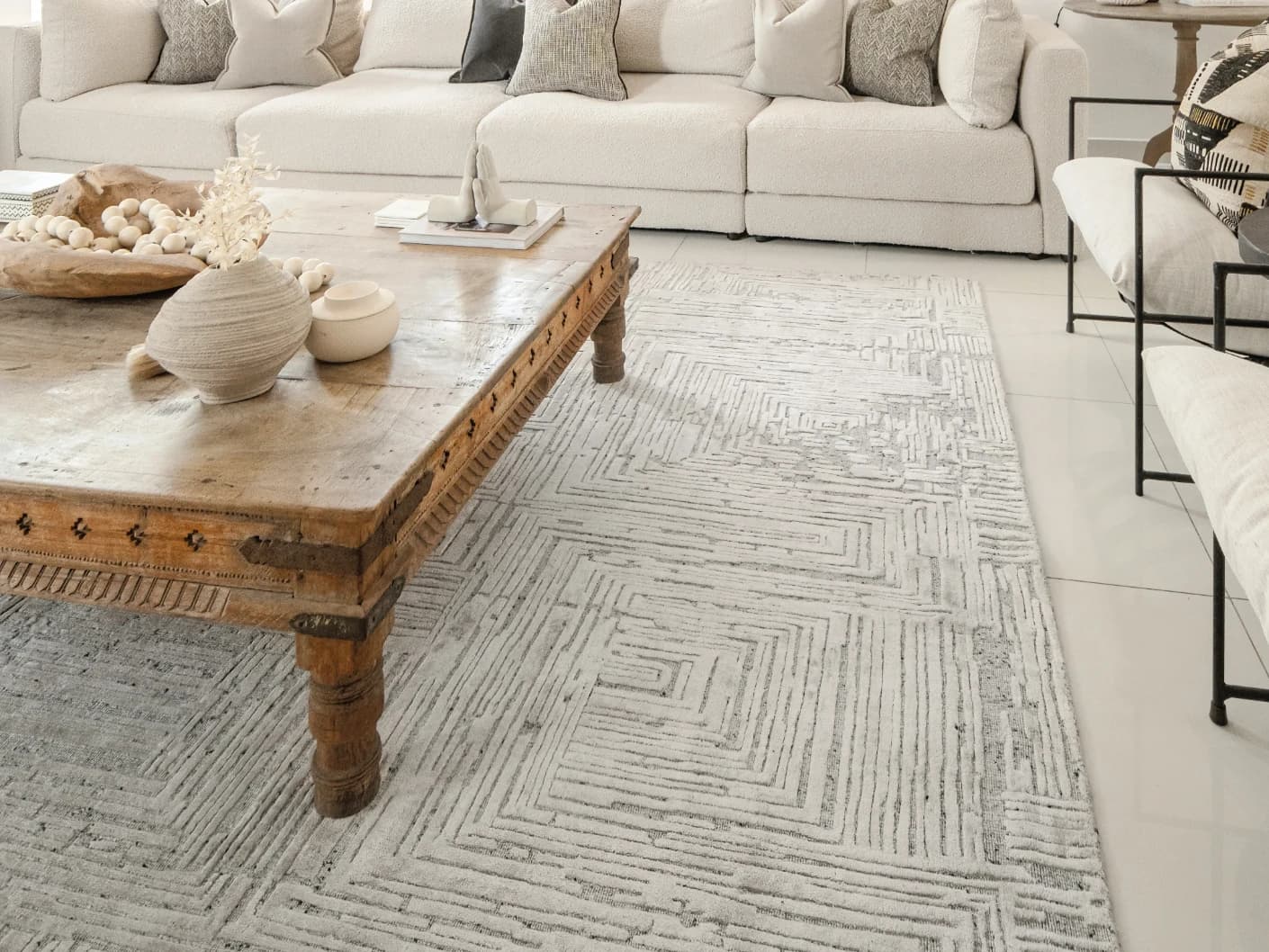 Eh Riley Stone Round carpet in beige, shown in a lifestyle left view as image 5
