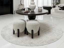 Eh Riley Stone Round carpet in beige, shown in a lifestyle front view