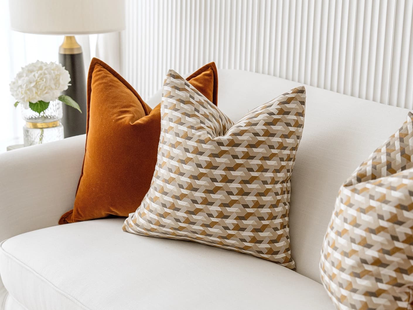 Elda Bundle bundle cushions in rust, shown in a lifestyle front view