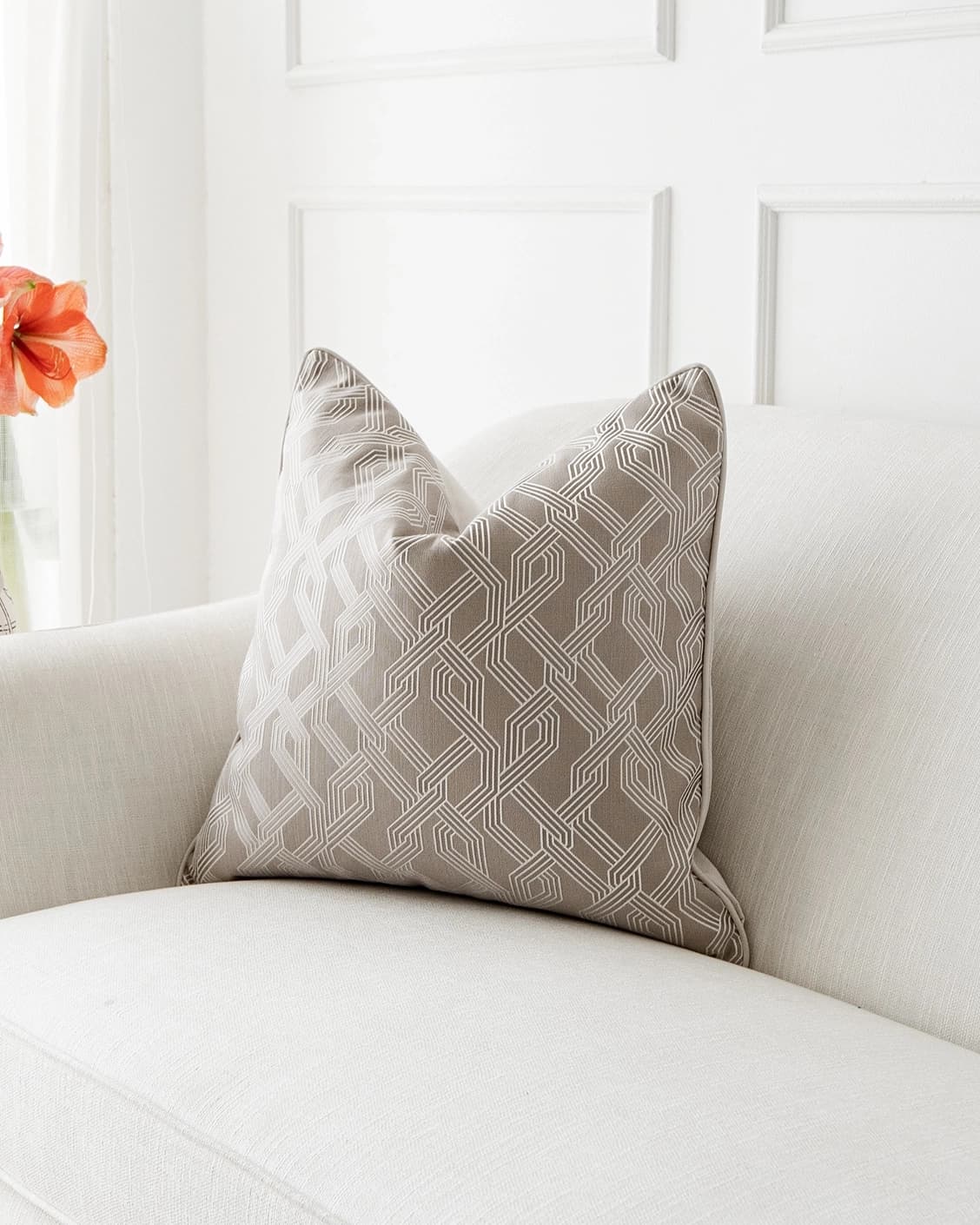 Elena Bianca cushion in beige and white, shown in a lifestyle front view as image 2