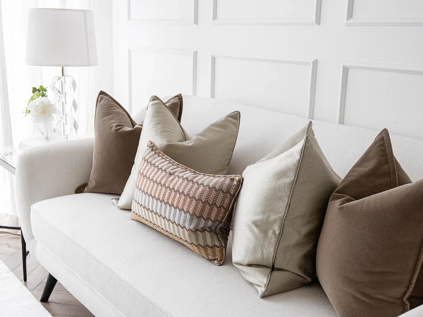 Eliana Bundle bundle cushions in orange, shown in a lifestyle front view