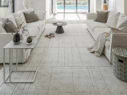 Elliot Alba carpet in grey and white, shown in a lifestyle front view
