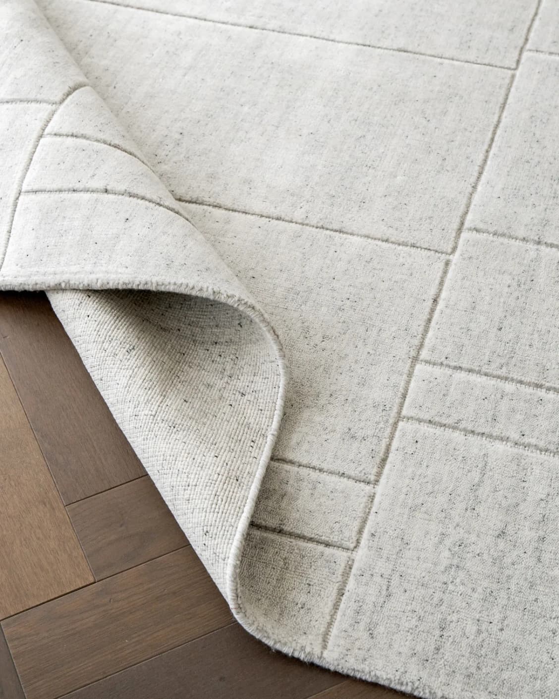 Elliot Alba carpet in grey and white, shown in a lifestyle top view as image 13