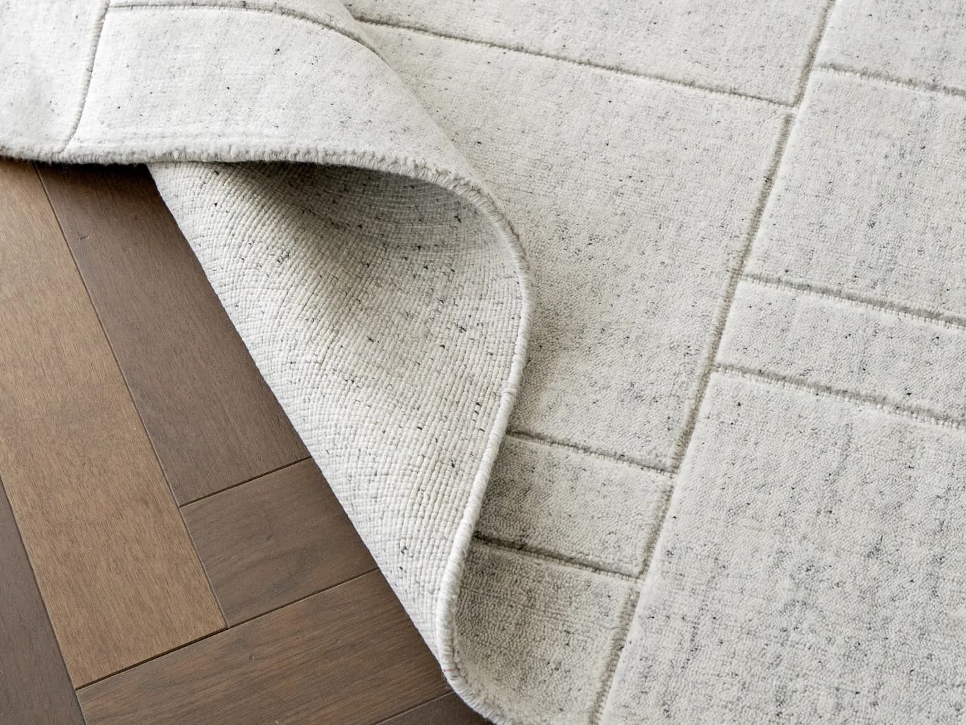 Elliot Alba carpets in grey and white, shown in a lifestyle front view as image 1