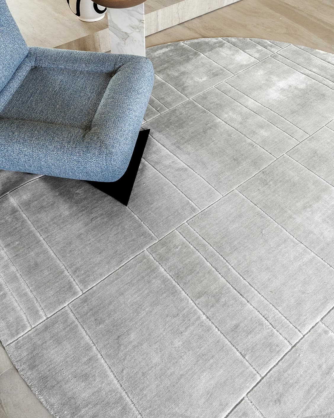 Elliot Ashton carpets in grey and silver, shown in a lifestyle close-up top view as image 1