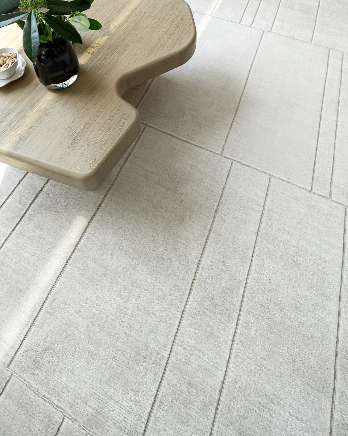 Elliot Ashton carpet in grey and silver, shown in a lifestyle close-up as image 4