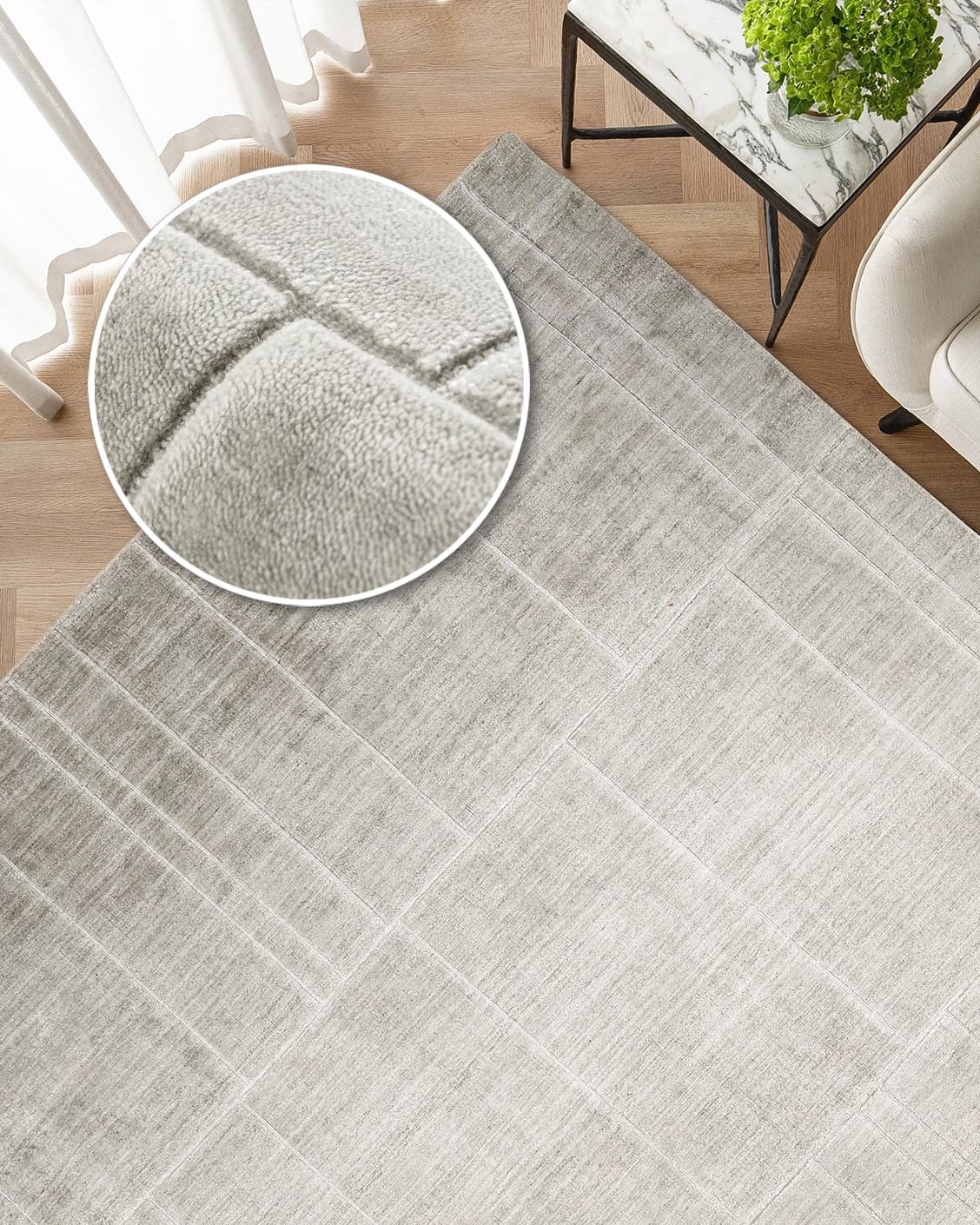 Elliot Ashton carpet in grey and silver, shown in a lifestyle top view as image 2