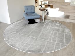 Elliot Ashton Round carpet in grey and silver, shown in a lifestyle front view