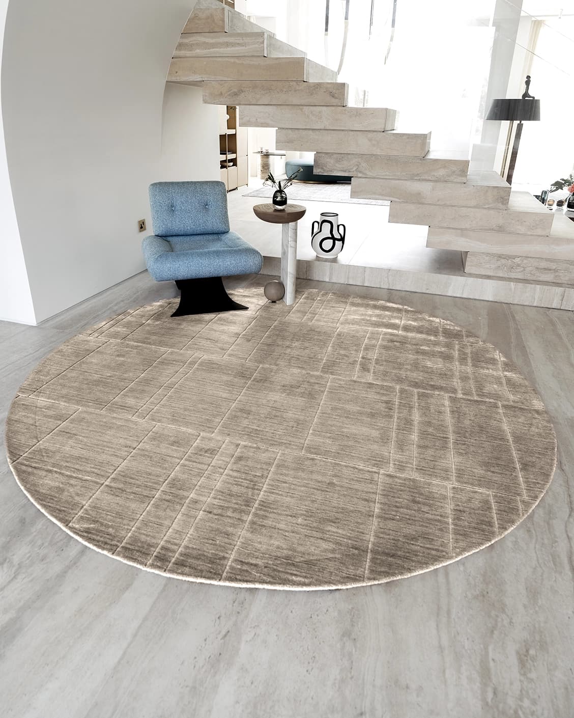 Elliot Sandy Round carpet in sandy, beige and taupe, shown in a lifestyle front view as image 2