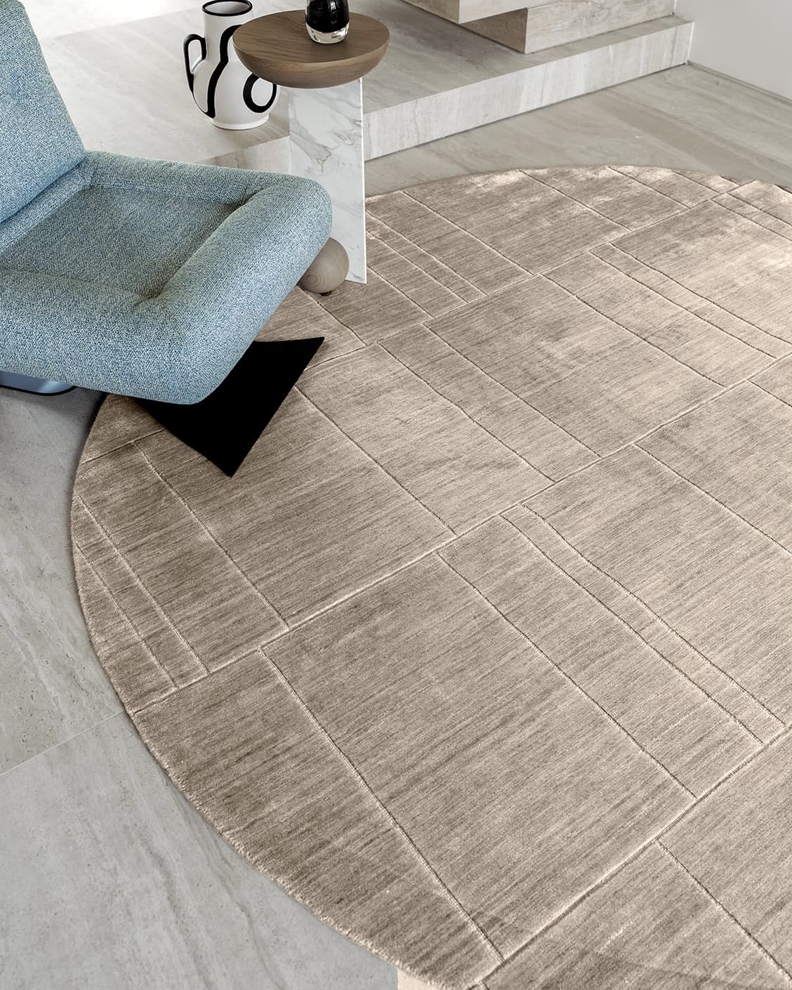 Elliot Sandy carpets in beige and taupe, shown in a lifestyle close-up top view as image 1