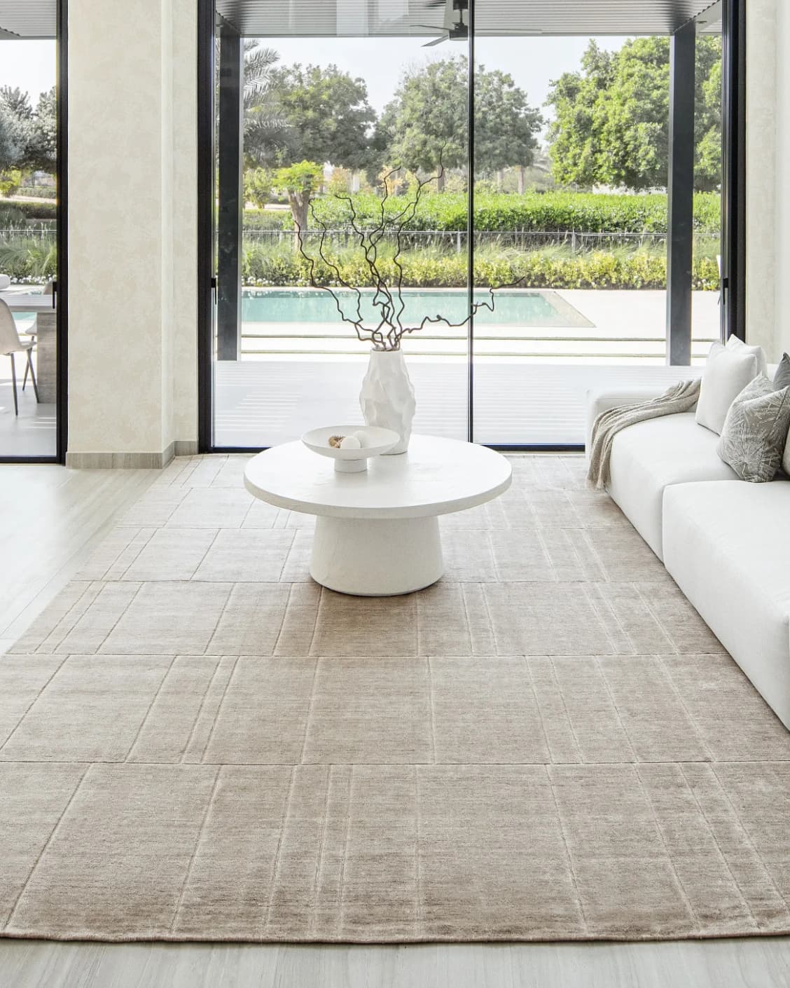 Elliot Sandy carpet in beige and taupe, shown in a lifestyle front view as image 7