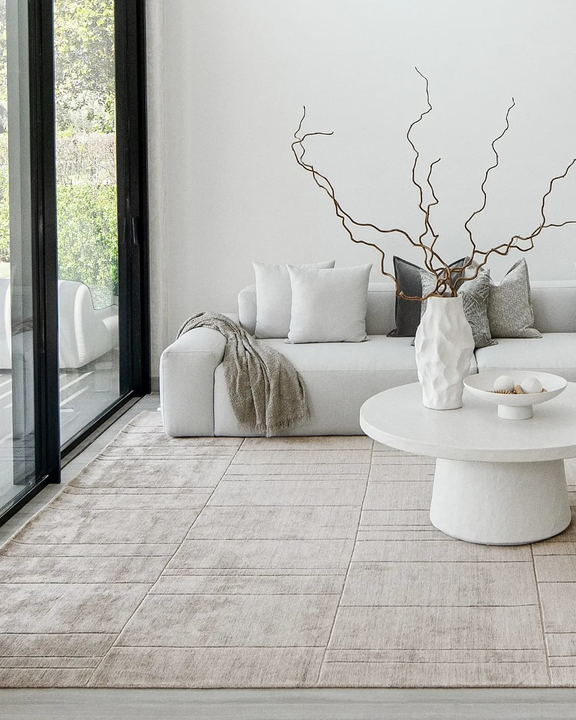 Elliot Sandy carpet in beige and taupe, shown in a lifestyle left view as image 8
