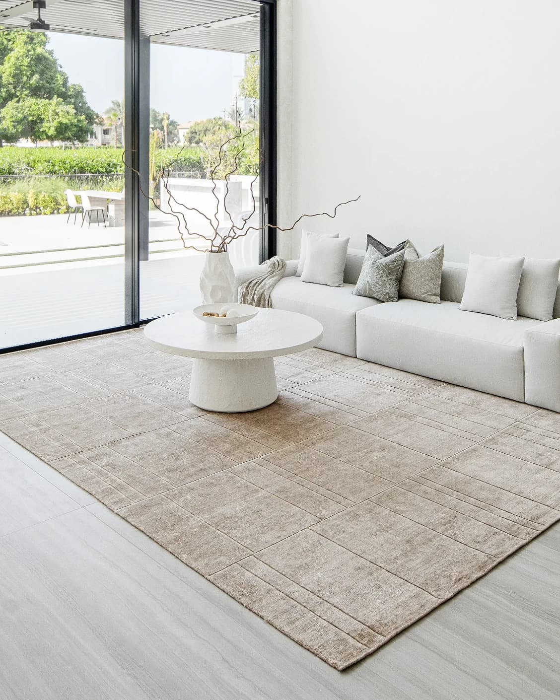 Elliot Sandy carpet in beige and taupe, shown in a lifestyle right view as image 9