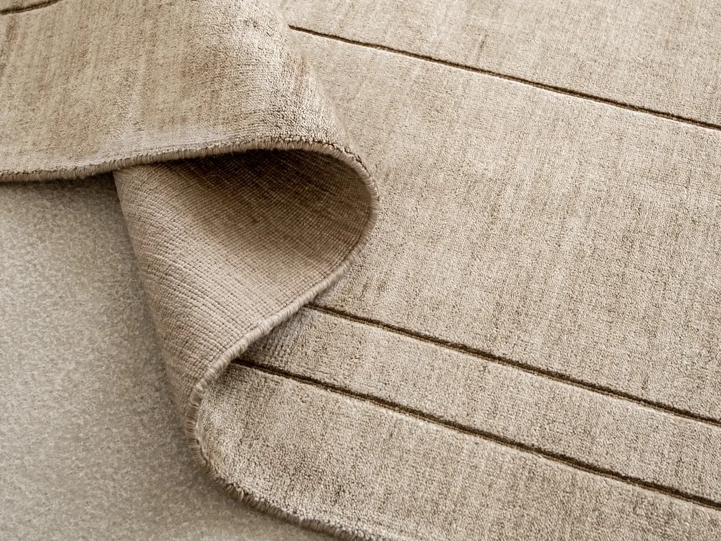 Elliot Sandy carpets in sandy, beige and taupe, shown in a product top view