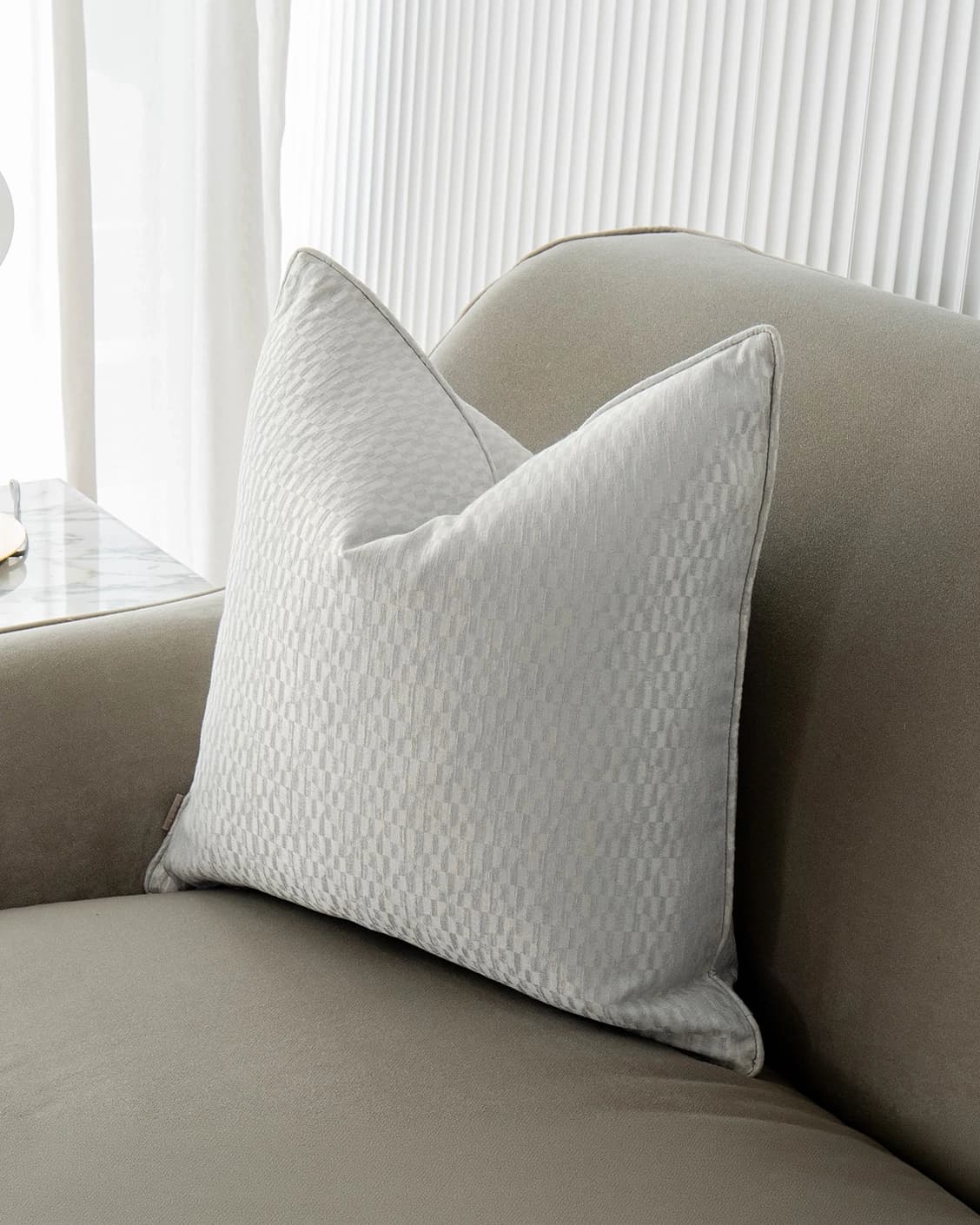 Elodie Bianca cushion in silver, shown in a lifestyle front view as image 2