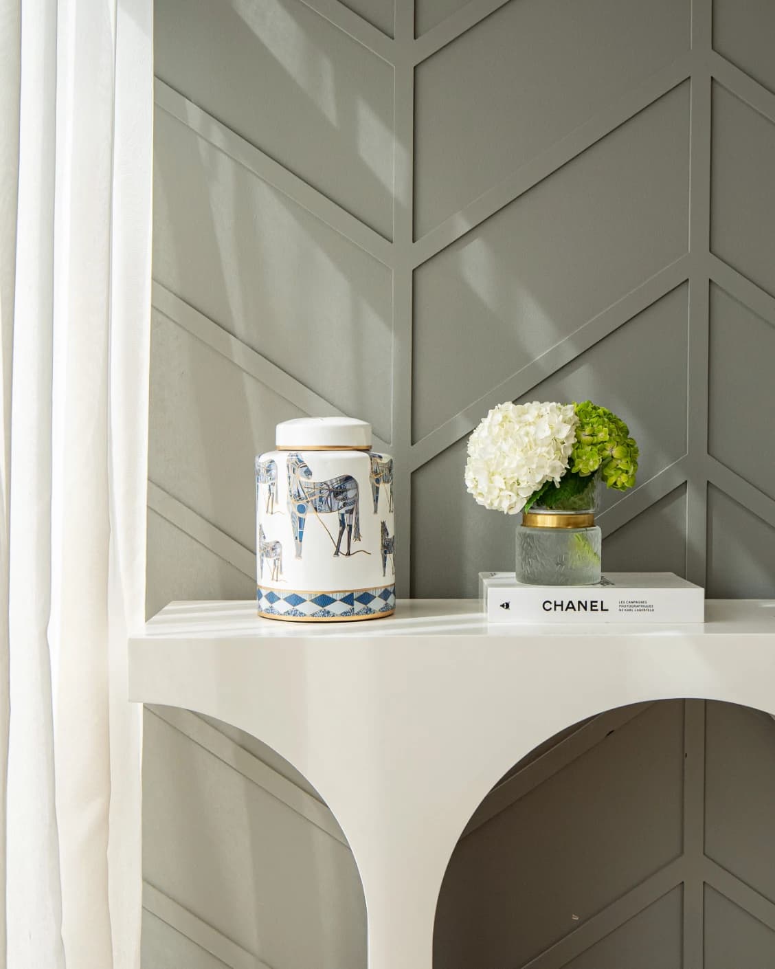 Eloisa Arneson II jars in white and blue, shown in a lifestyle front view as image 4