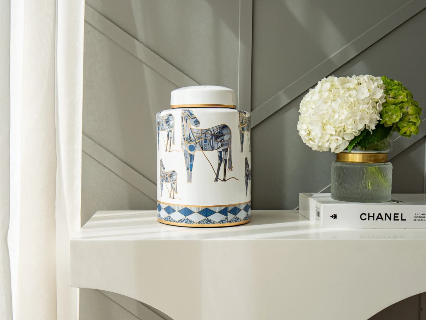 Eloisa Arneson jars in white and blue, shown in a lifestyle front view