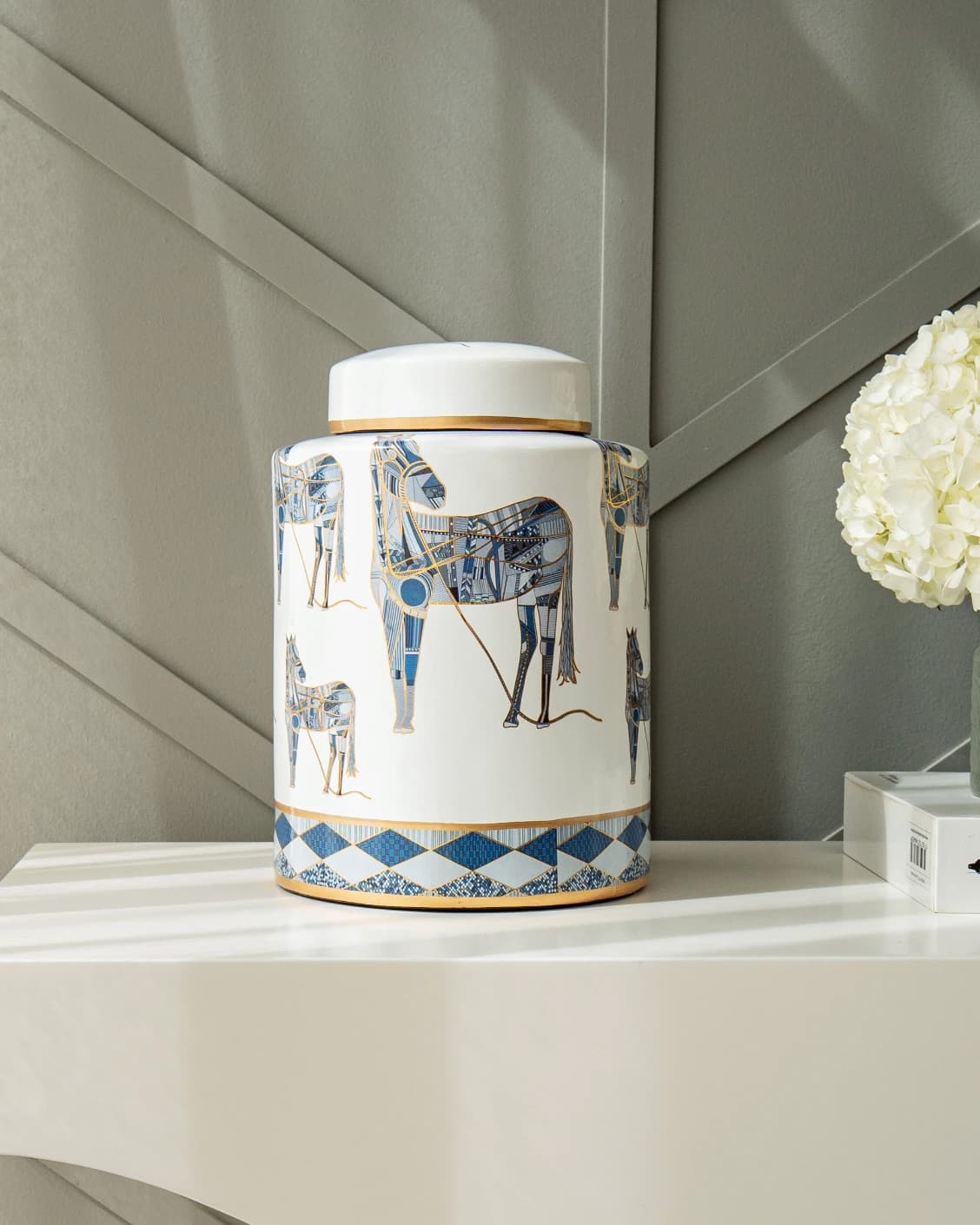 Eloisa Arneson II jars in white and blue, shown in a lifestyle front view as image 6