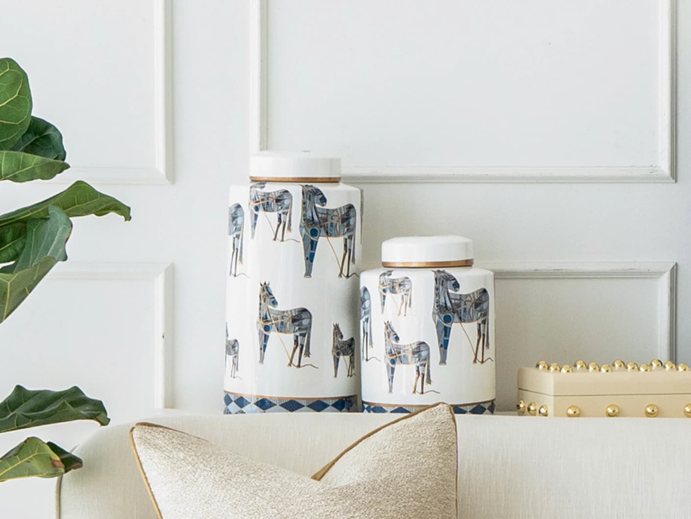 Eloisa Bundle canisters in white and blue, shown in a lifestyle front view