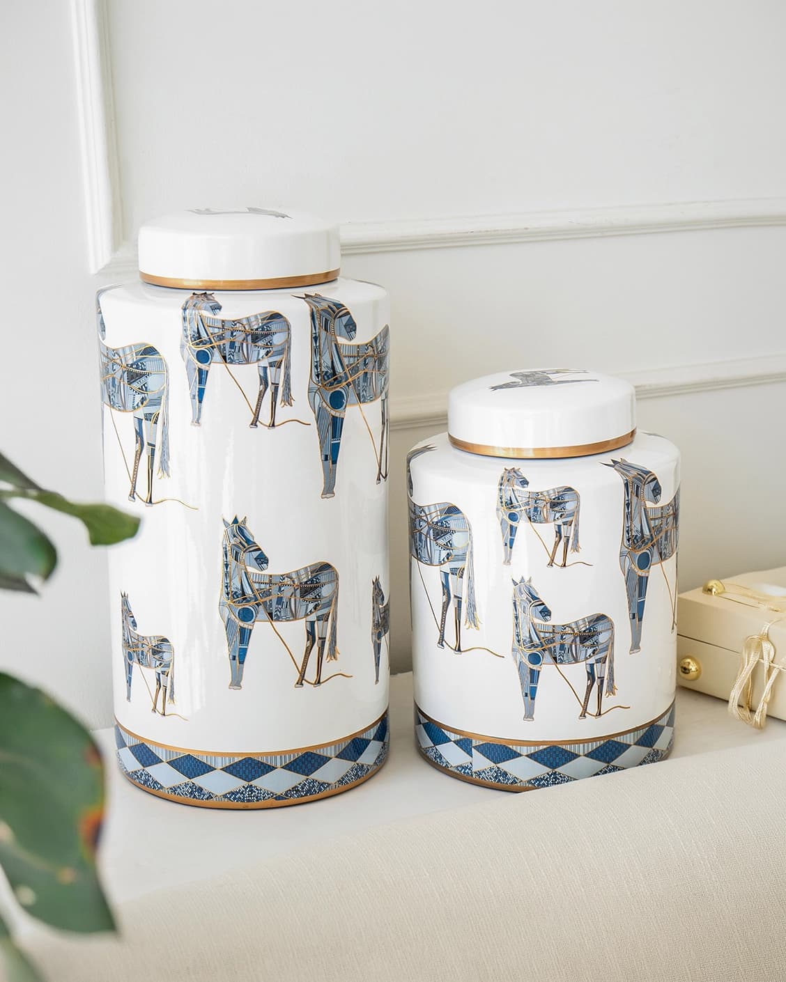 Eloisa Bundle canisters in white and blue, shown in a lifestyle left view as image 2