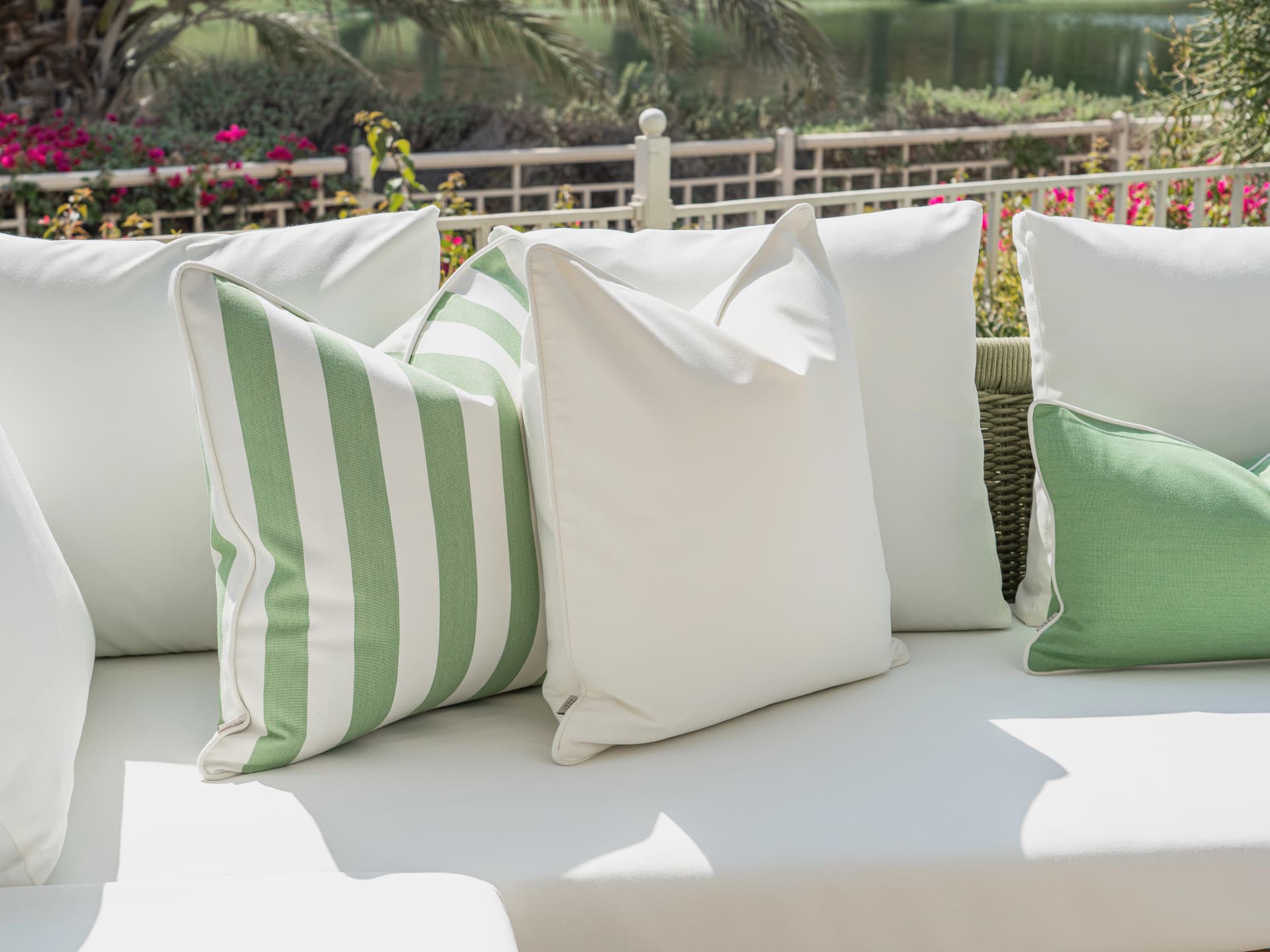 Elovie Bundle bundle cushions in green and ivory, shown in a lifestyle front view
