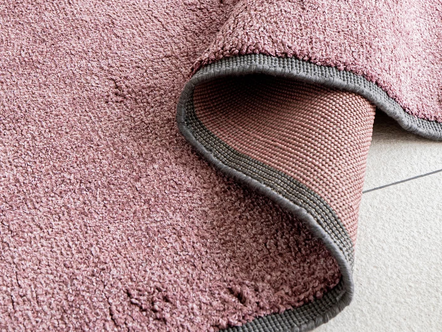 Elyse Rosso carpets in pink, shown in a product close-up view