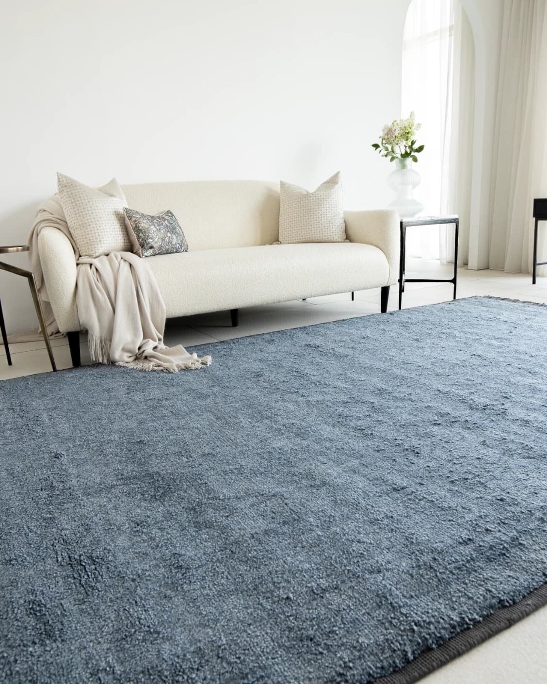 Elyse Sky carpets in blue, shown in a lifestyle left view as image 2