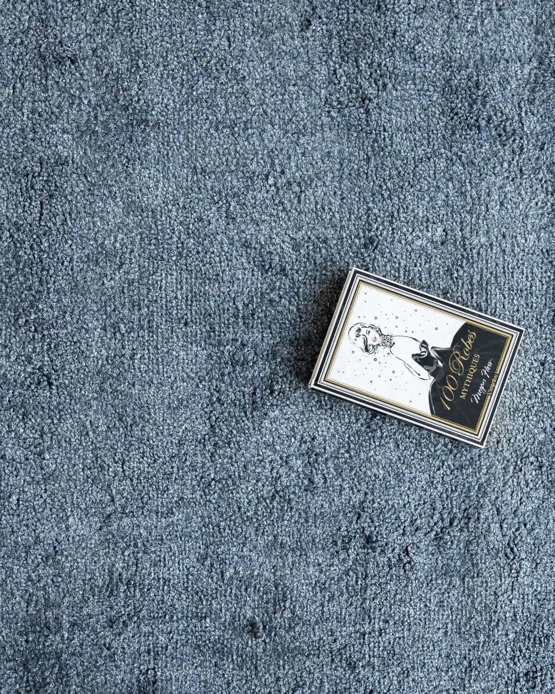Elyse Sky carpets in blue, shown in a lifestyle top view as image 3