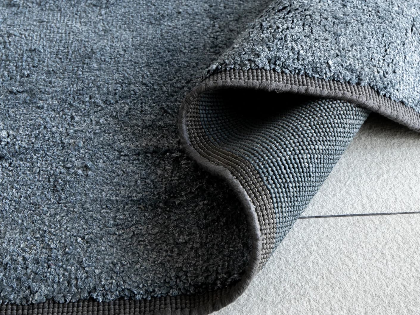 Elyse Sky carpets in sky and blue, shown in a product close-up view