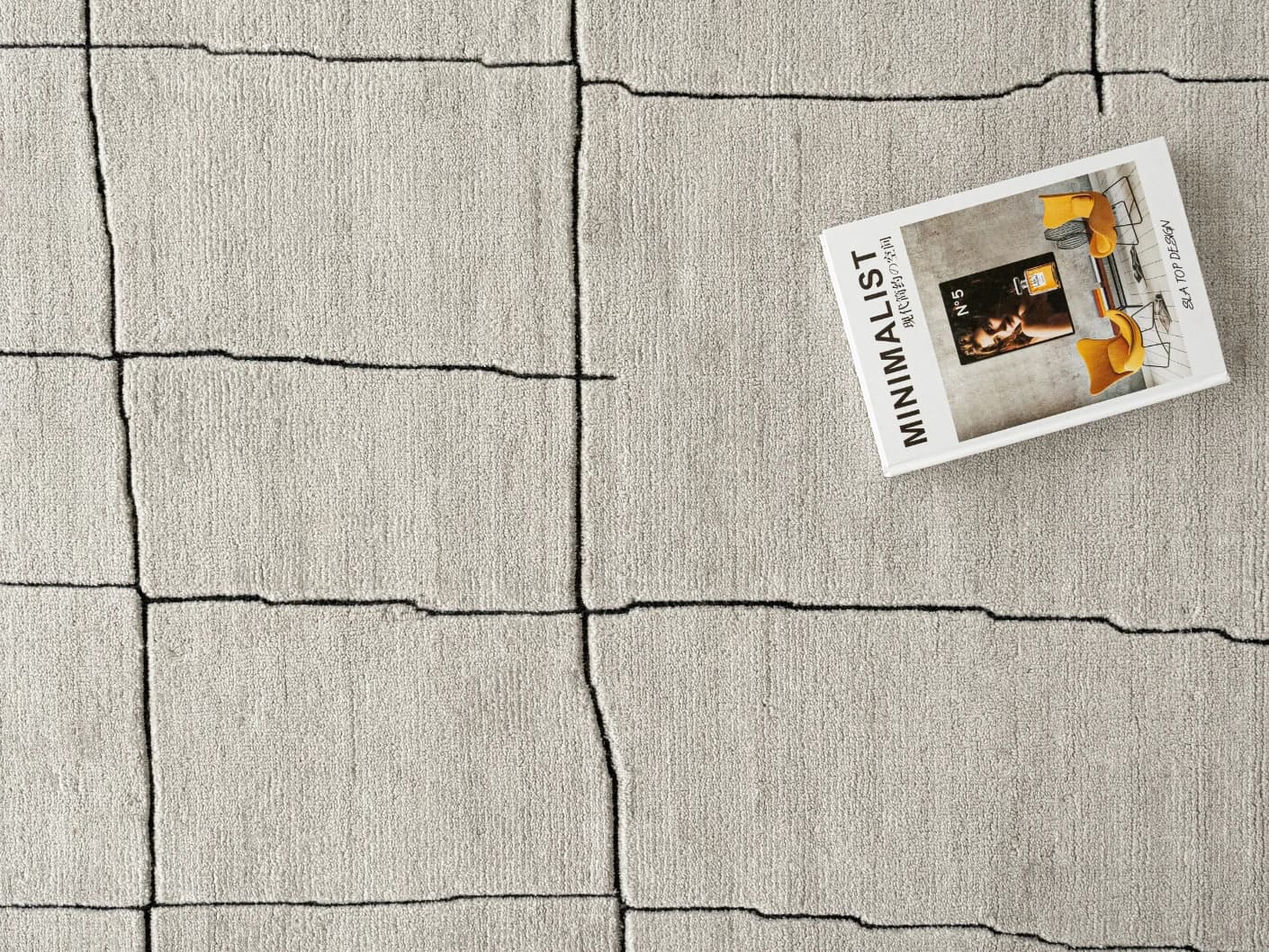 Emme Bianca carpets in off white, shown in a lifestyle close-up top view as image 1