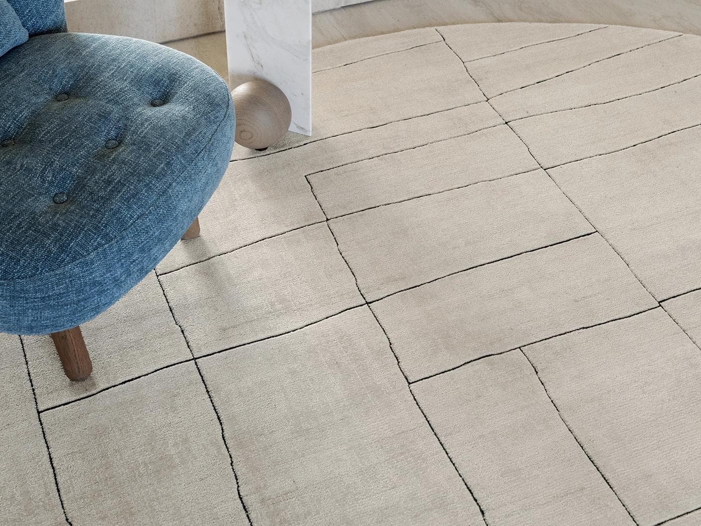 Emme Bianca carpets in off white, shown in a lifestyle close-up top view as image 1
