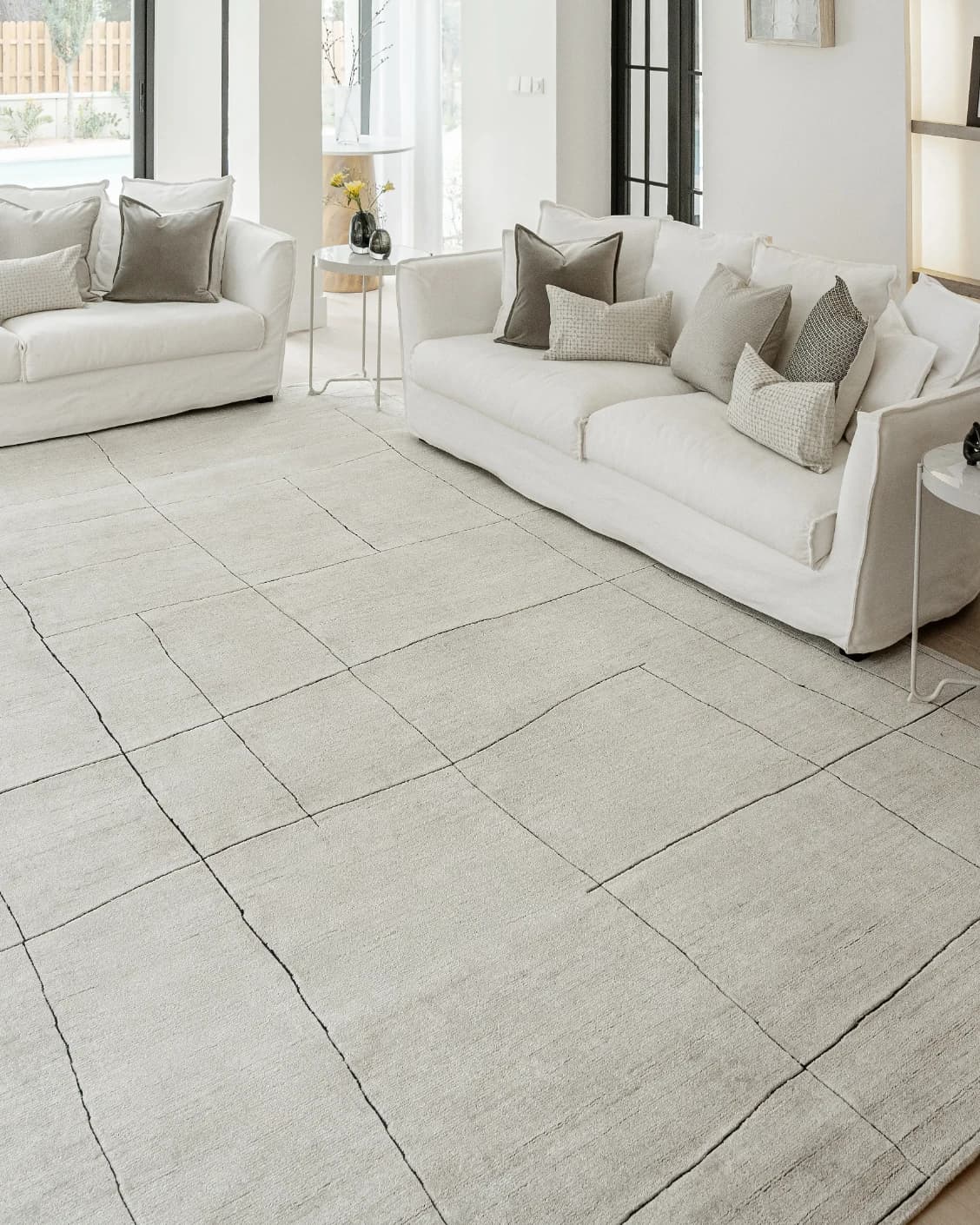 Emme Bianca carpet in off white, shown in a lifestyle left view as image 7