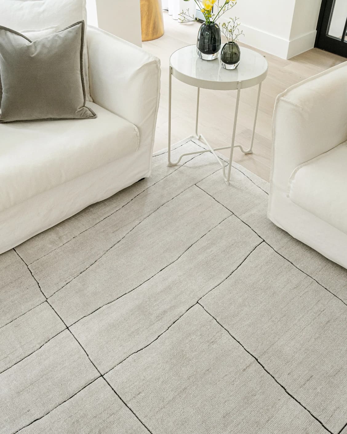 Emme Bianca carpet in off white, shown in a lifestyle top view as image 10