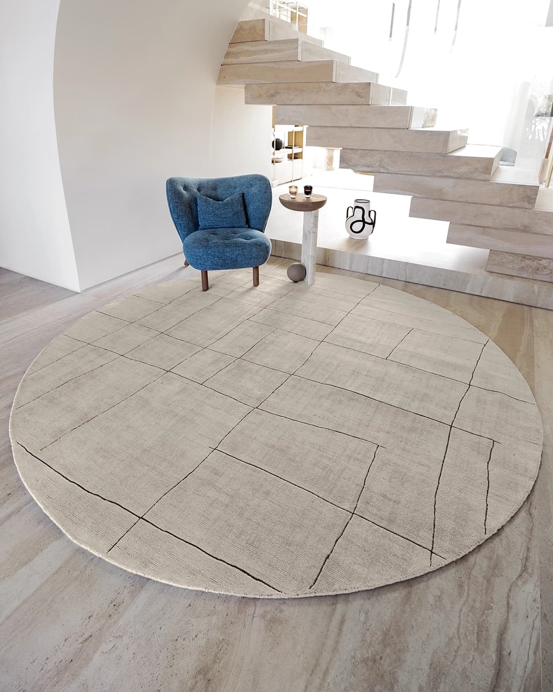 Emme Bianca Round carpet in off white, shown in a lifestyle front view as image 2