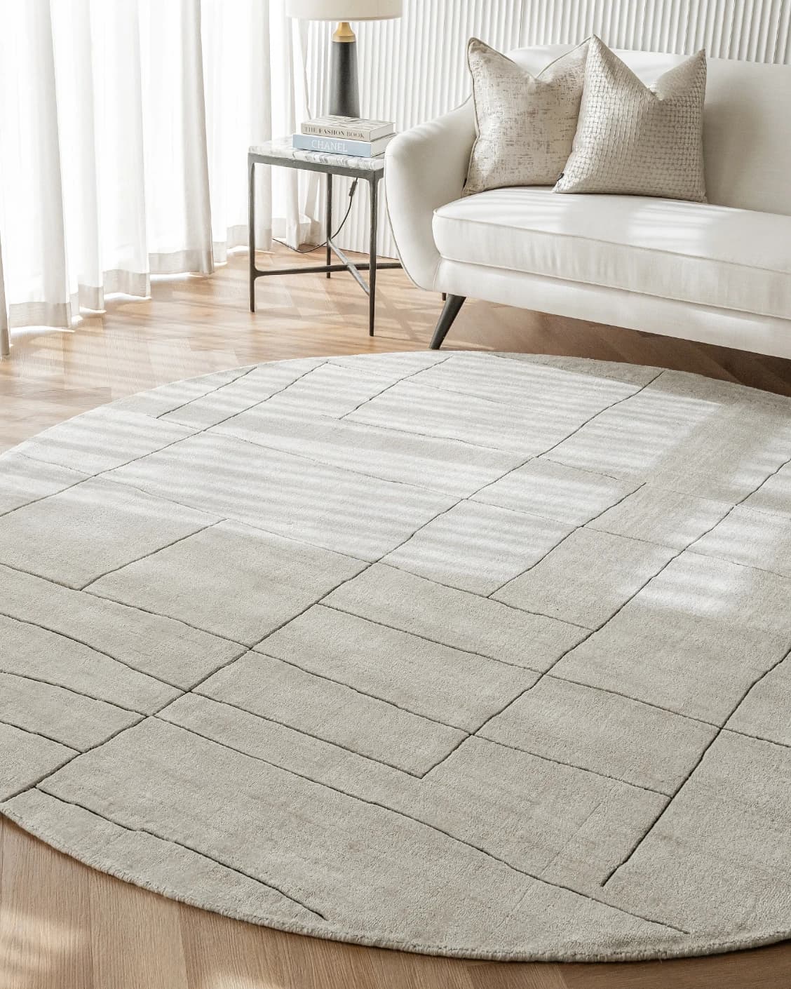 Emme Bianca Round carpet in off white, shown in a lifestyle front view as image 5