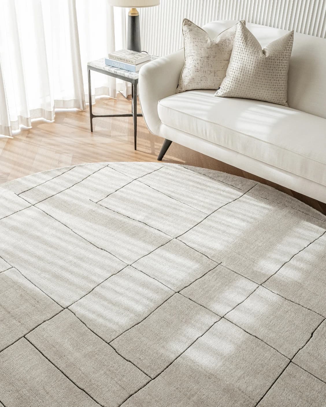 Emme Bianca Round carpet in off white, shown in a lifestyle right view as image 6
