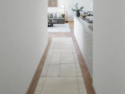 Emme Bianca Runners carpet in off white, shown in a lifestyle front view
