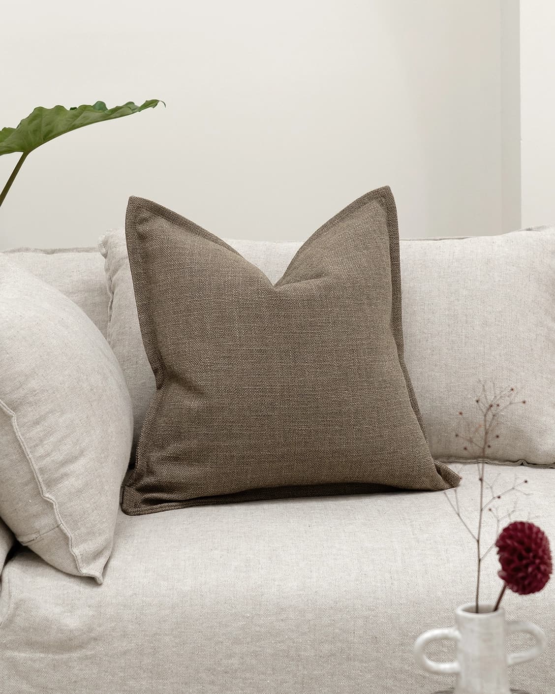 Emmett Braun cushion in brown, shown in a lifestyle front view as image 2