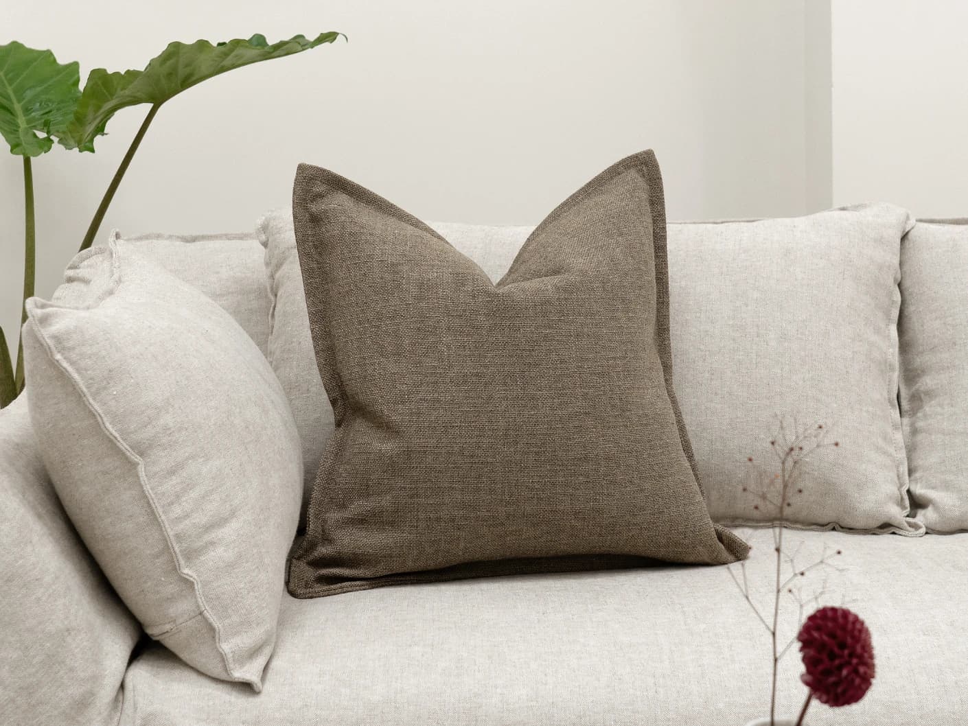 Emmett Braun single cushions in brown, shown in a lifestyle front view