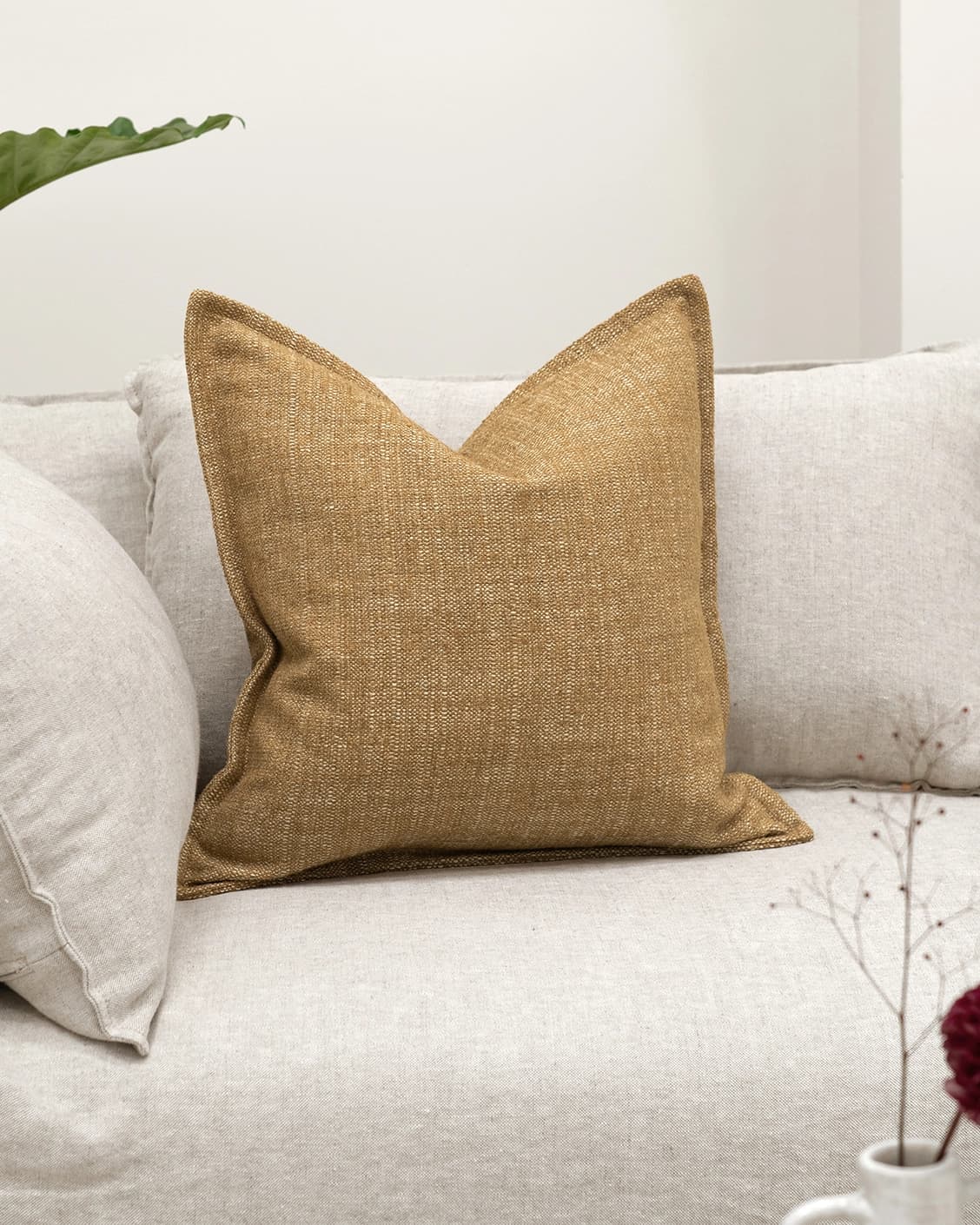 Emmett Dijon cushion in beige, shown in a lifestyle front view as image 2