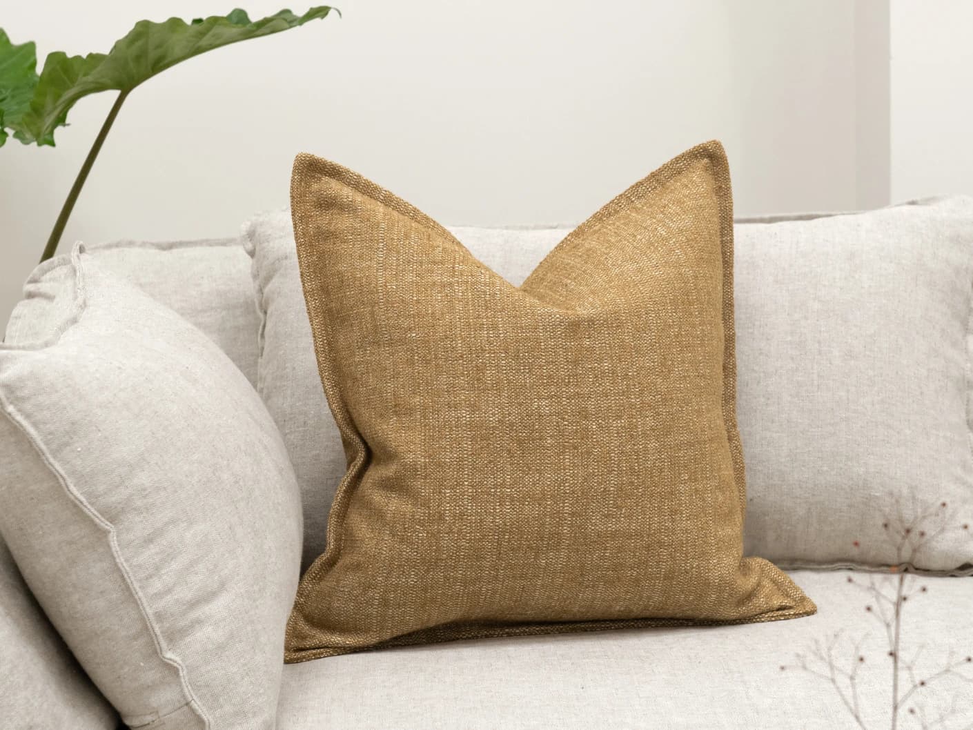 Emmett Dijon single cushions in beige, shown in a lifestyle front view