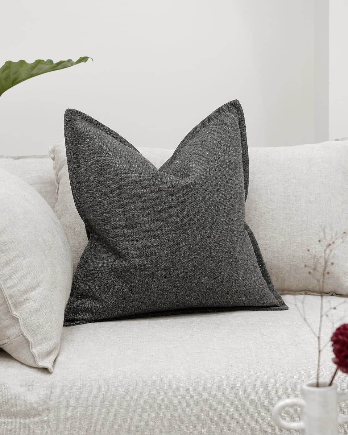 Emmett Nyx cushion in grey, shown in a lifestyle front view as image 2