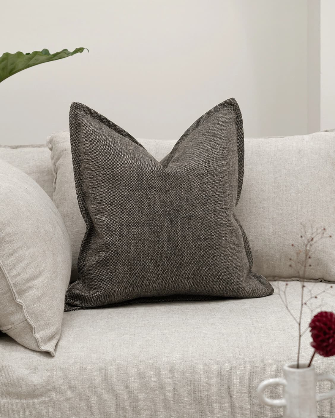 Emmett Pepper cushion in charcoal, shown in a lifestyle front view as image 2