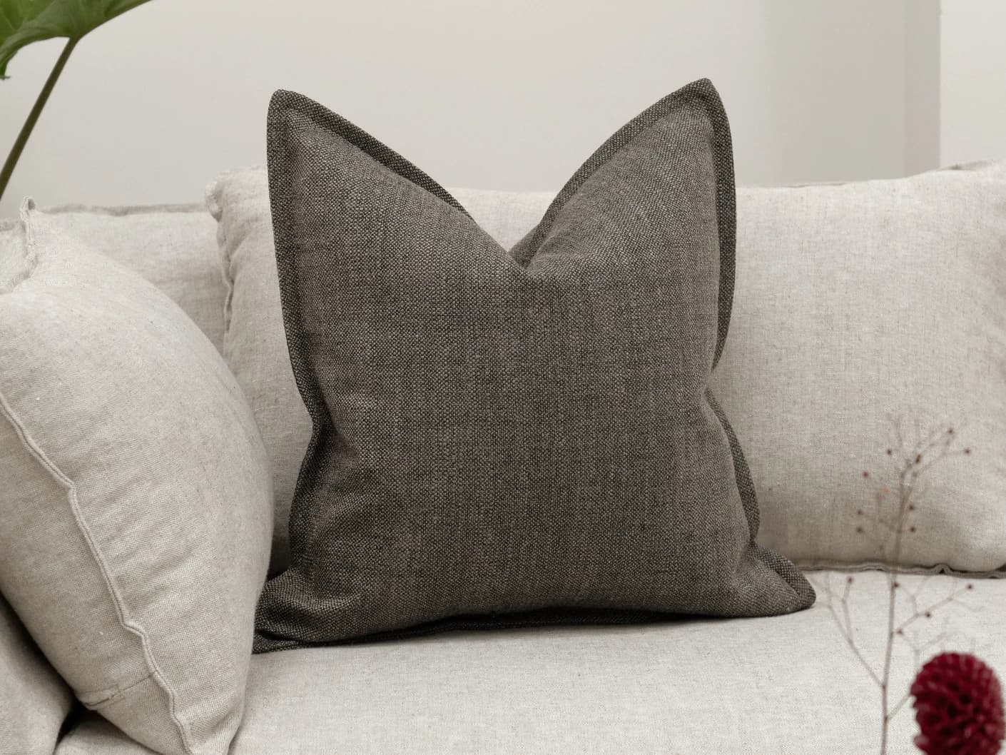 Emmett Pepper single cushions in charcoal, shown in a lifestyle front view