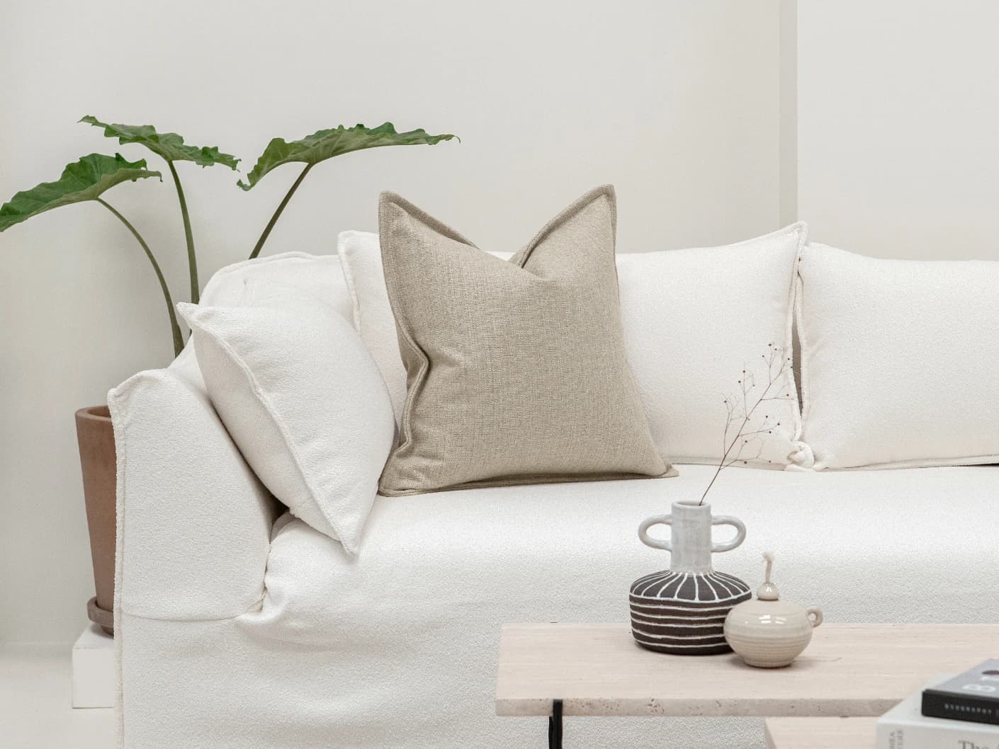Emmett Shale single cushions in beige, shown in a lifestyle front view