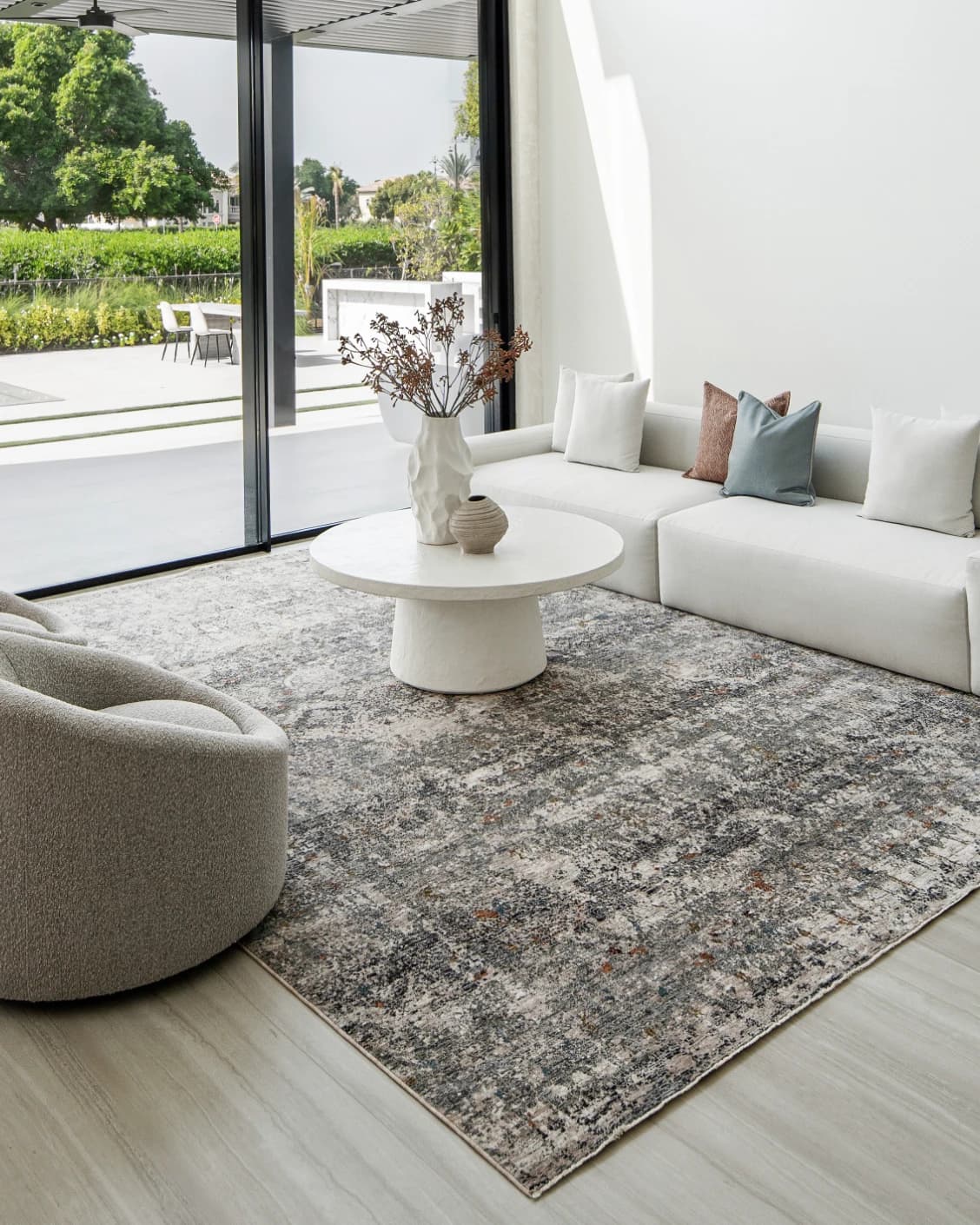 Ethan Ashton carpet in grey and beige, shown in a lifestyle front view as image 4