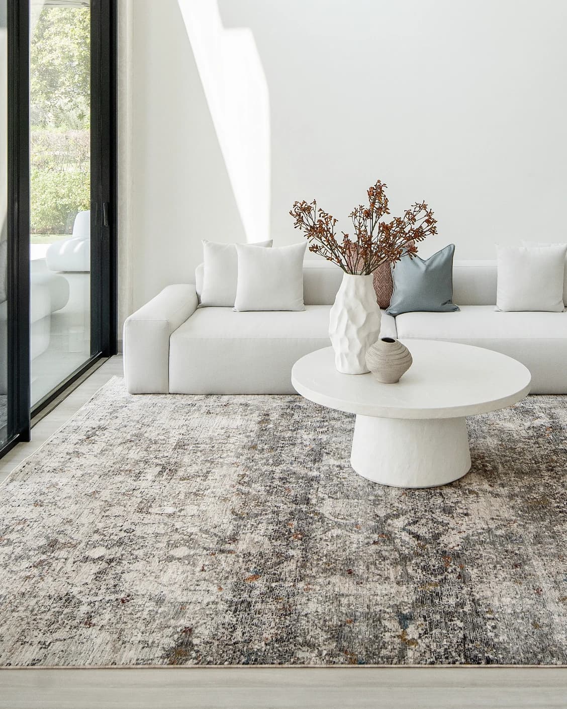 Ethan Ashton carpet in grey and beige, shown in a lifestyle front view as image 7